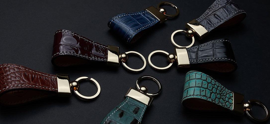 Premium leather accessories by Hedonist including key holders, luggage tags, and small everyday carry essentials