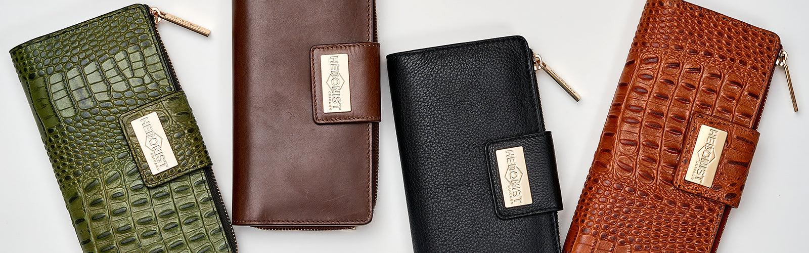 Trifold Women's Leather Wallets with snap closures, crafted for organized daily essentials.