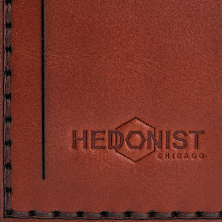 Hedonist Chicago light mahogany luggage tag in light mahogany, with strap, full grain leather, flat lay view