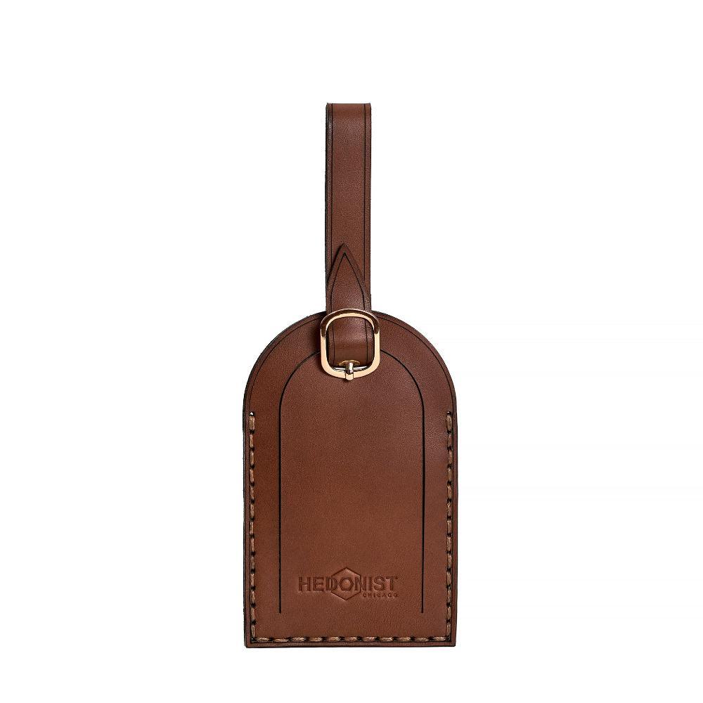 Hedonist Chicago whisky luggage tag in whisky, with strap, full grain leather, product view