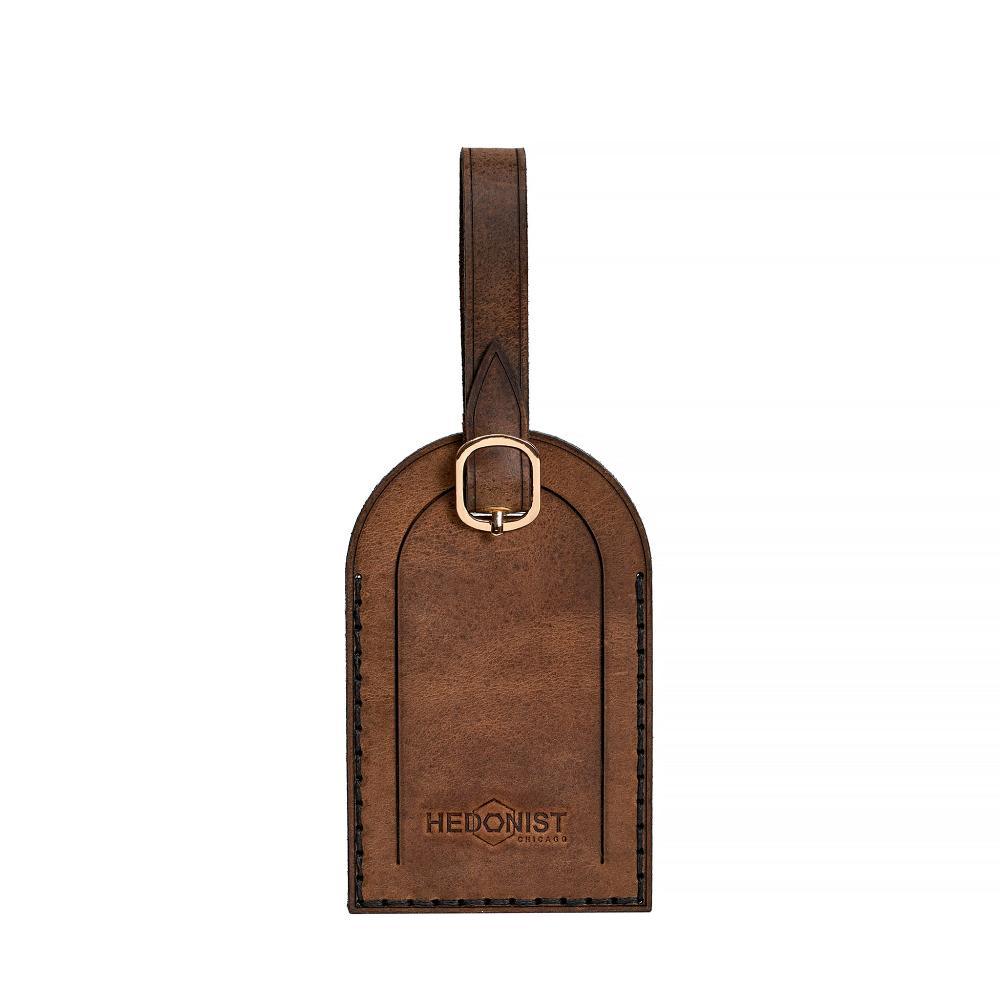 Hedonist Chicago whisky luggage tag in whisky, with strap, full grain leather, product view