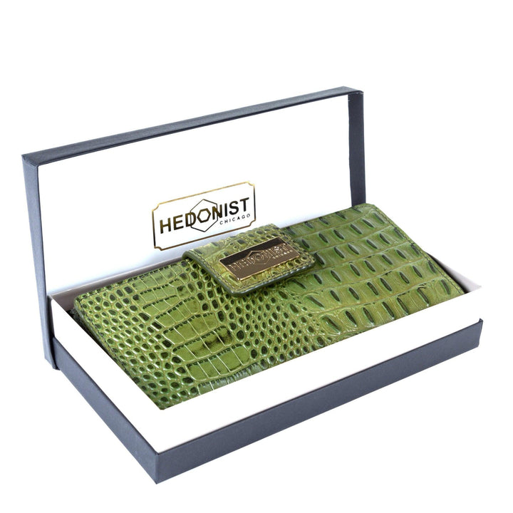 Green croc-embossed leather long travel wallet for women in Hedonist Chicago branded gift box