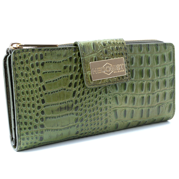 Front view of women’s green croc-embossed leather long travel wallet with secure zip-around closure