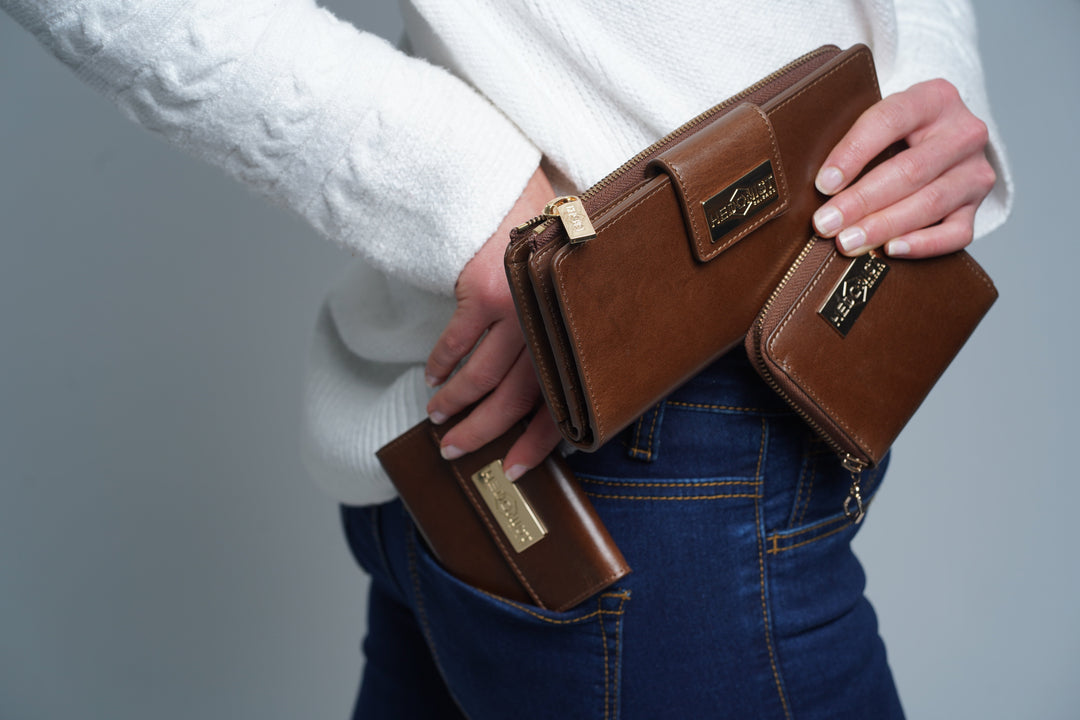 Compact snap closure wallet for women in leather with metal snap plate and flap design for one-handed access