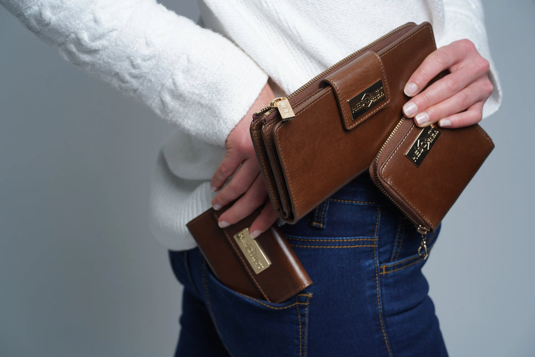 Compact snap closure wallet for women in leather with metal snap plate and flap design for one-handed access