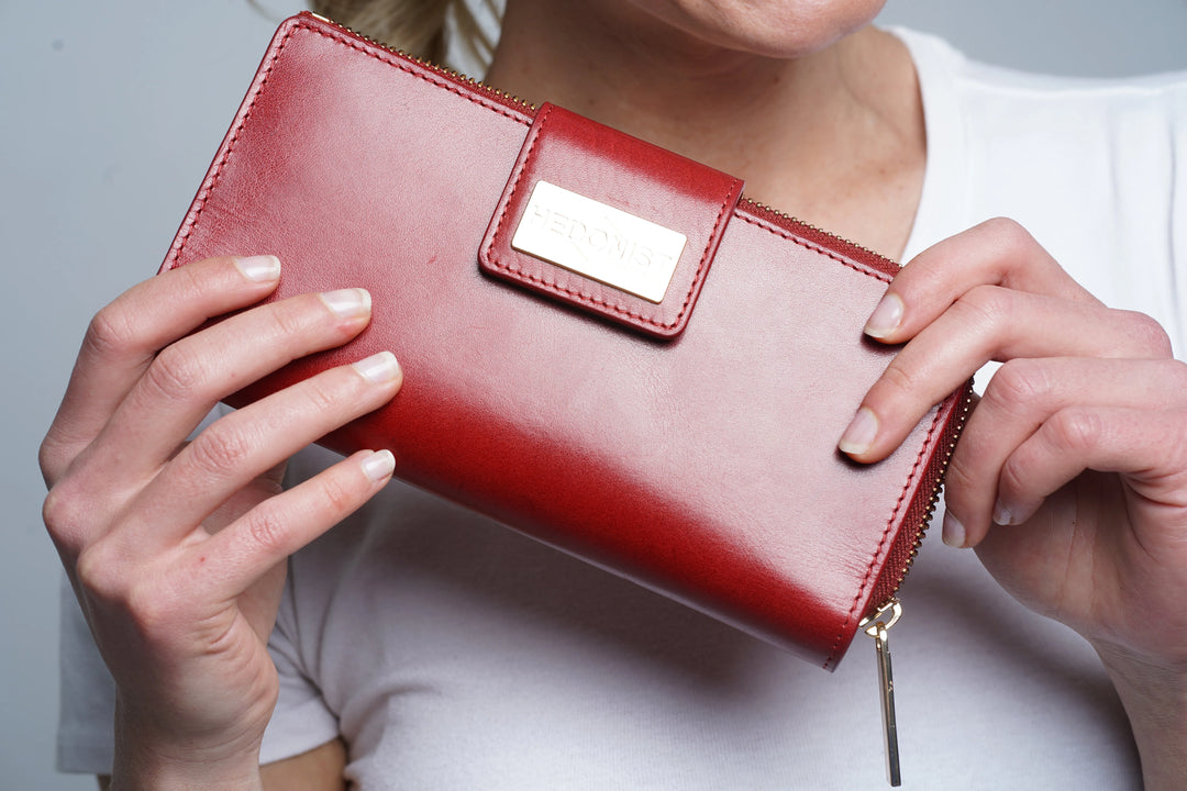 Red leather wallets for women in various styles including trifold, long, and zip wallets