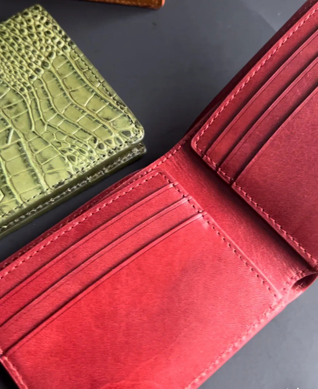 Red or green leather wallet styles for men, a bold color statement for the season.