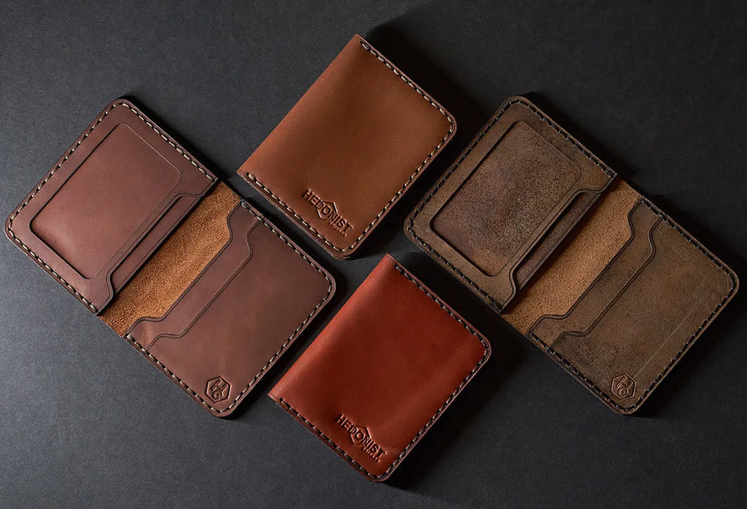Handmade leather goods collection showing artisan wallets, card holders, and accessories with hand-stitched construction