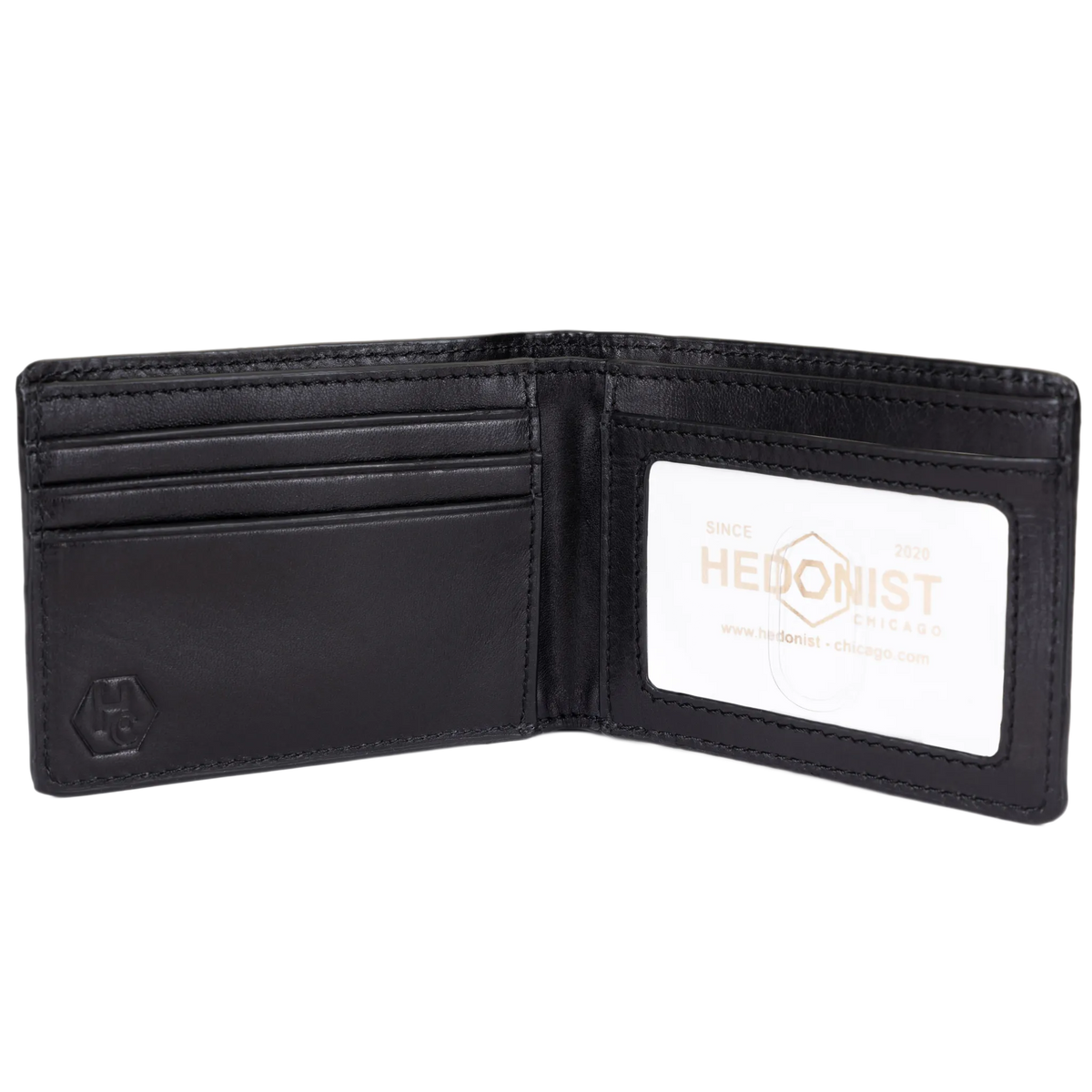 A black leather bi-fold wallet shown open, featuring multiple card slots on the left and a clear ID window on the right with a white insert displaying the Hedonist brand logo.