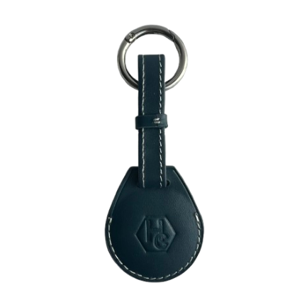 A blue leather AirTag Holder with white contrast stitching, featuring an embossed logo on the teardrop-shaped tag and a silver metal key ring