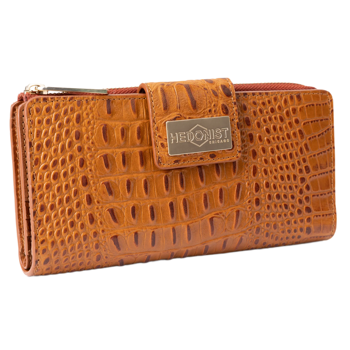 Brown croco-embossed leather travel wallet closed, front flap with gold-tone Hedonist Chicago plaque