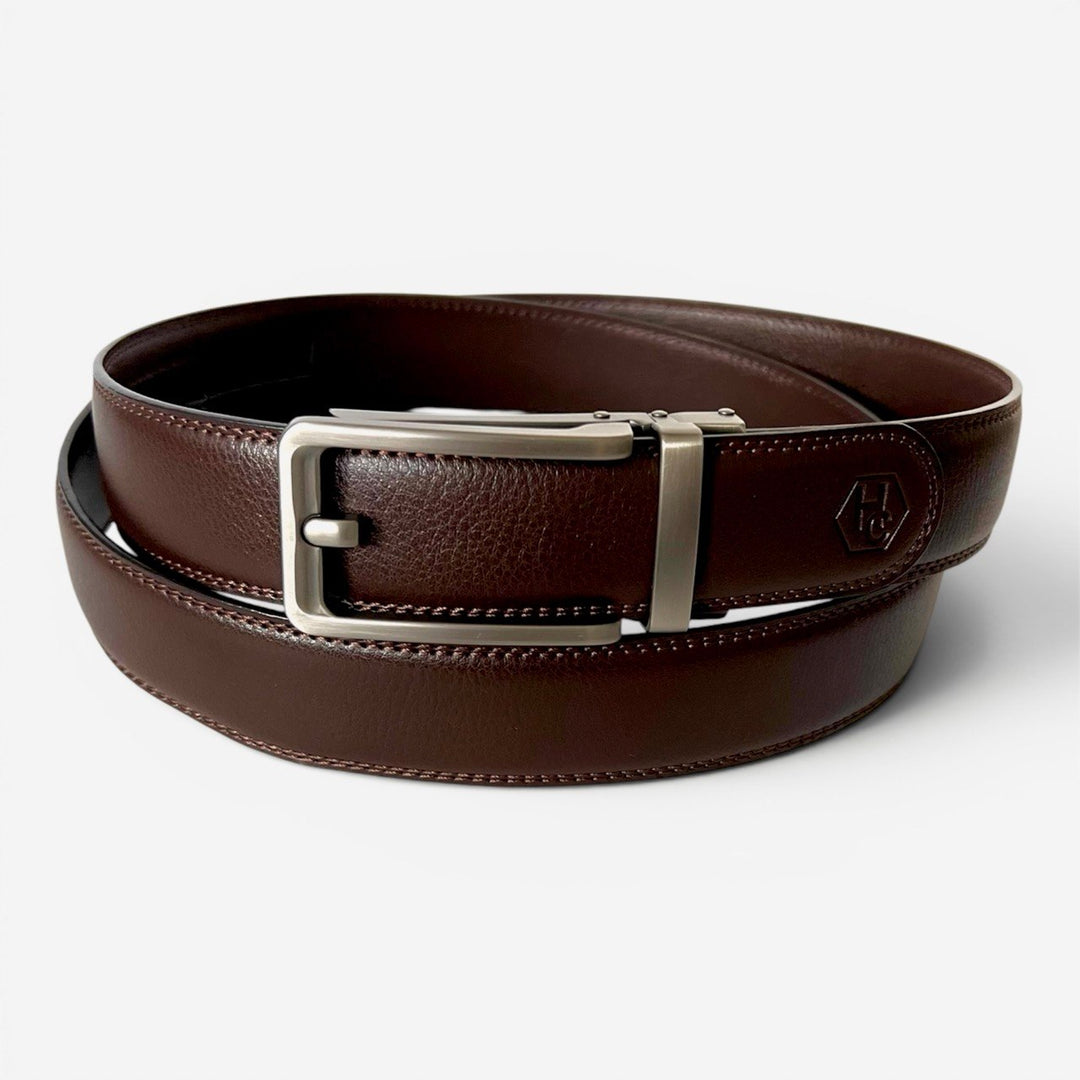 Brown leather belt with silver buckle on a white background