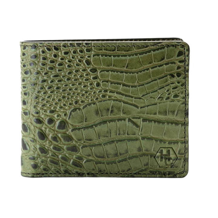 Green bifold wallet with a crocodile-embossed texture and a small debossed logo on the bottom right, shown against a plain white background.