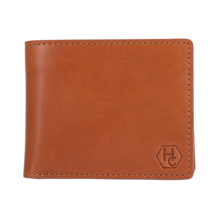 A brown leather bi-fold wallet with a debossed 'HC' logo in the bottom right corner, shown on a plain white background.