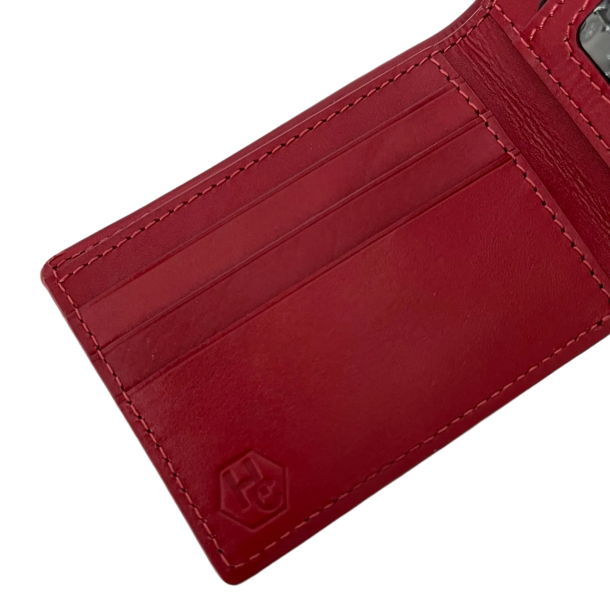 A close-up of a red leather cardholder wallet showing the interior card slots, stitching, and an embossed logo on a white background.