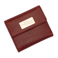A red leather bi-fold wallet with a gold-tone metal brand plaque on the front flap.