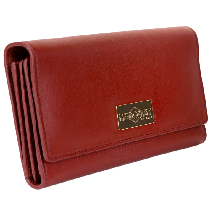 Red pebbled leather trifold wallet for women closed, gold-tone Hedonist Chicago plaque on front