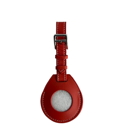 A red leather AirTag Holder with a teardrop-shaped body and a silver metal buckle 