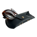 Soft Leather Eye Glasses Case in Black with tortoiseshell sunglasses leaning against it