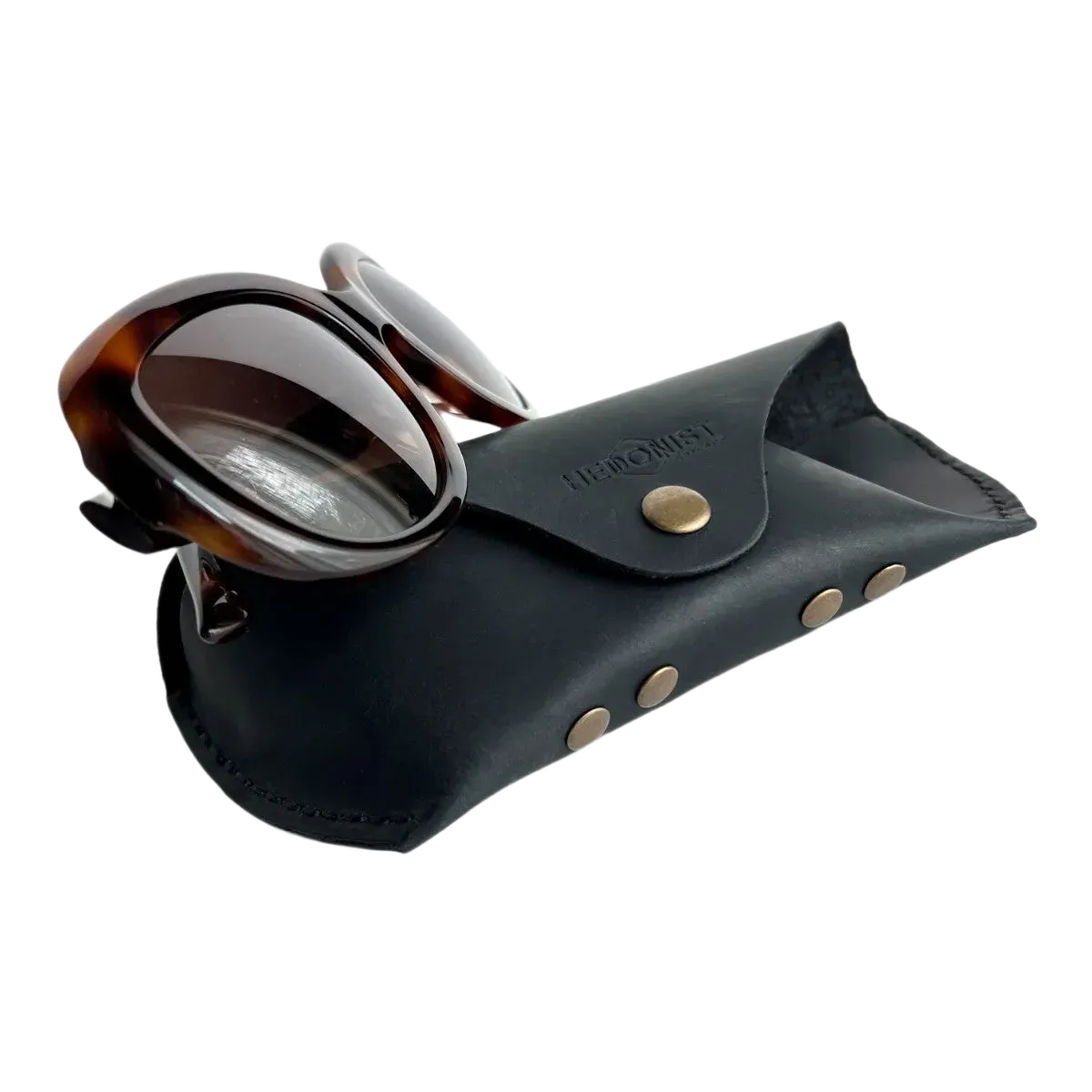 Soft Leather Eye Glasses Case in Black with tortoiseshell sunglasses leaning against it