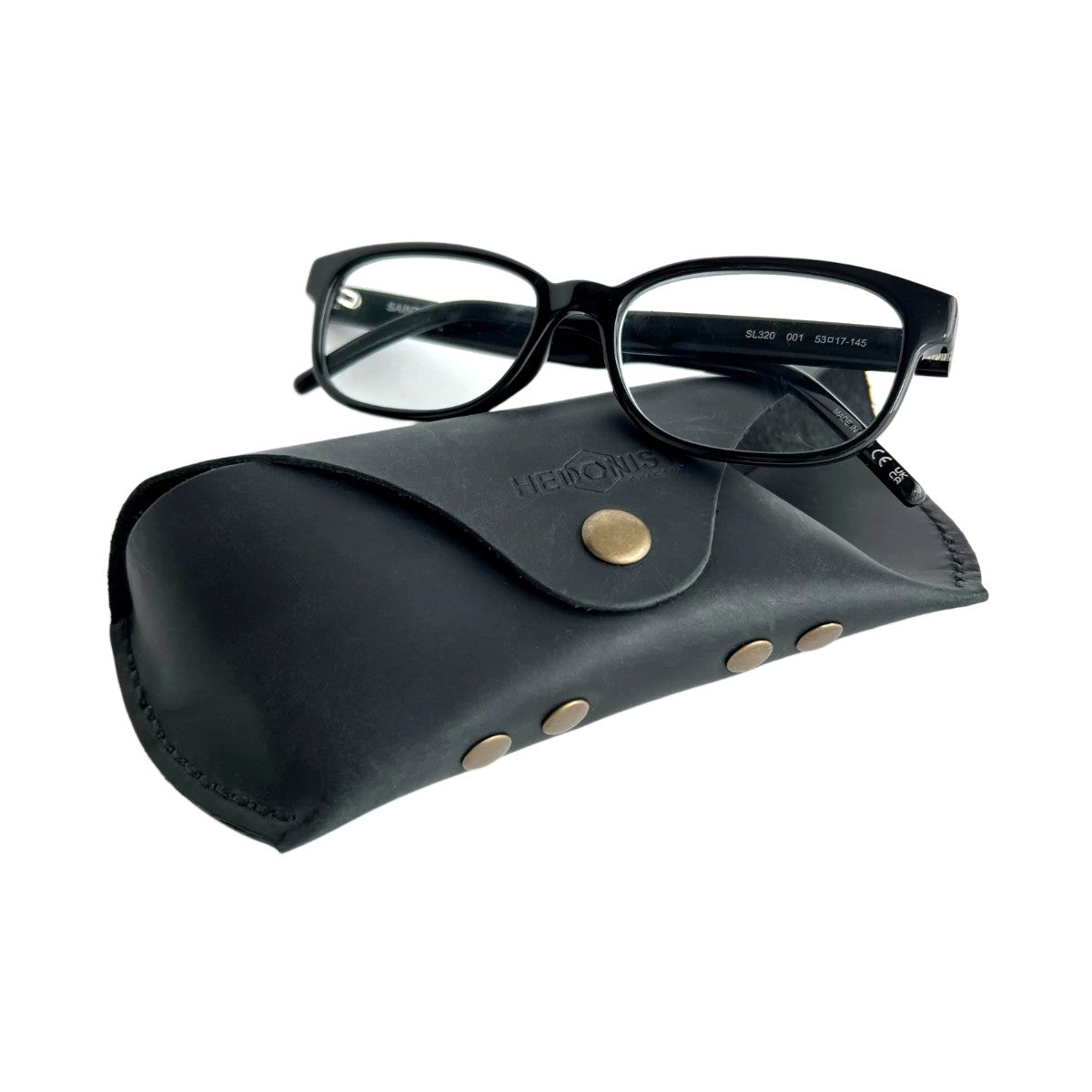 Soft Leather Eye Glasses Case in Black with black-framed eyeglasses resting on top