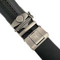 Black croco leather ratchet belt with gunmetal buckle, hardware close-up, textured leather