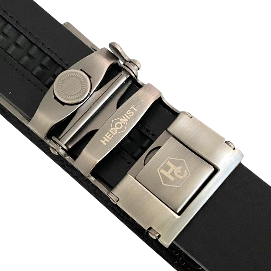 Black croco leather ratchet belt with long gunmetal rectangle buckle, hardware close-up