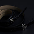 Side view on women's reversible design leather belt - black - Hedonist Chicago - close-up view (1"/1.3", reversible with ivory)