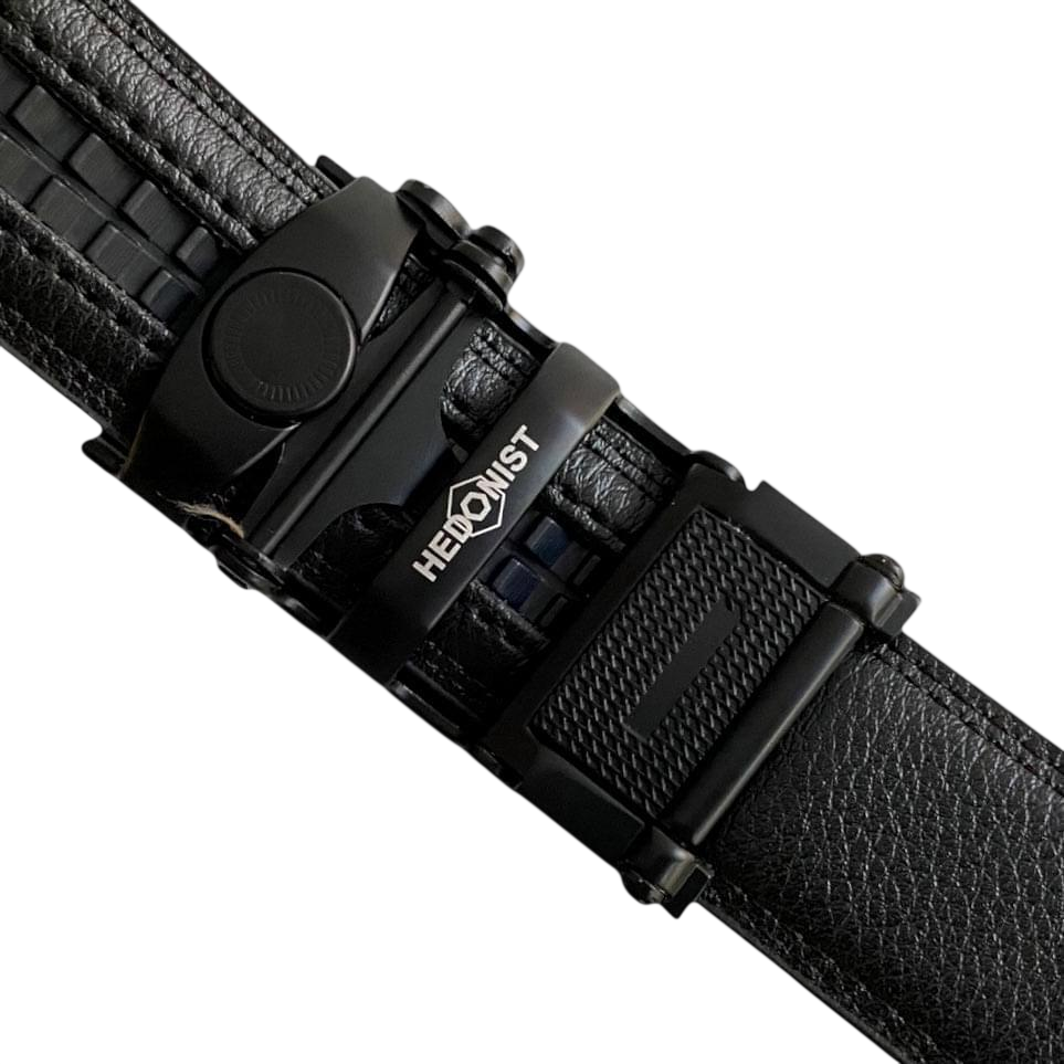 Black leather dress ratchet belt with black plate buckle, hardware close-up