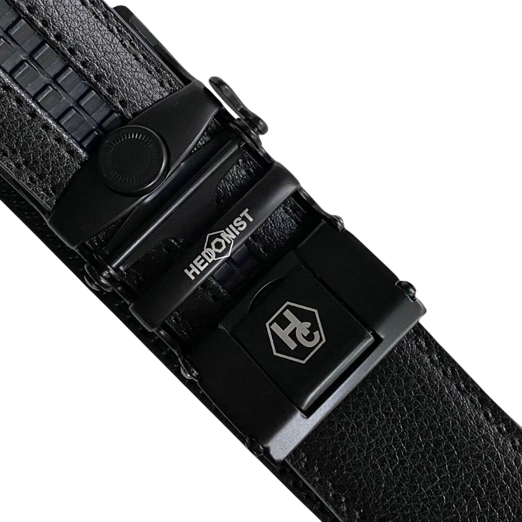Black leather ratchet belt with black buckle, hardware close-up