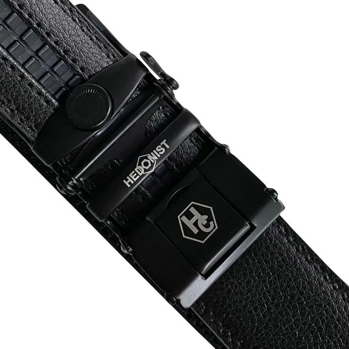Black leather ratchet belt with black buckle, hardware close-up