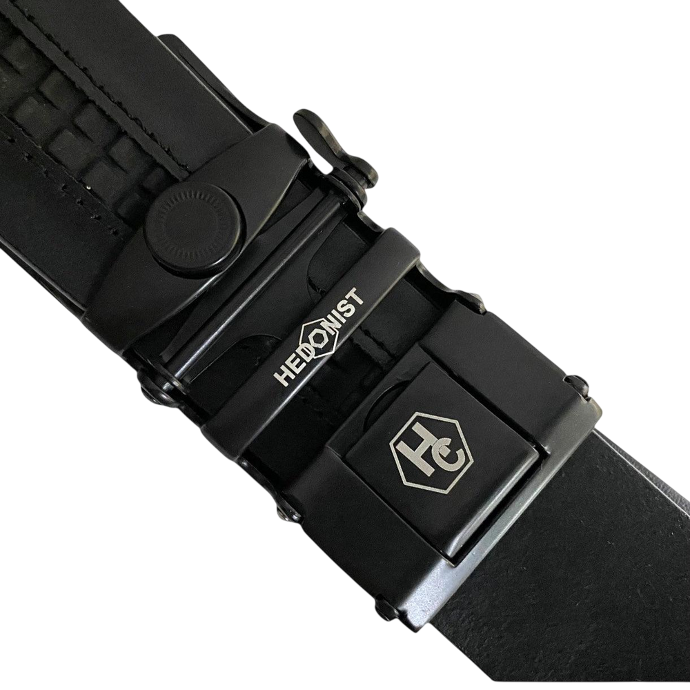 Black leather ratchet belt with black plate buckle, hardware close-up