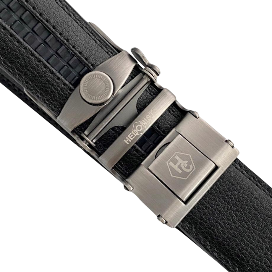 Black leather ratchet belt with gunmetal buckle, hardware close-up