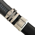 Black leather ratchet belt with long gunmetal rectangle buckle, hardware close-up