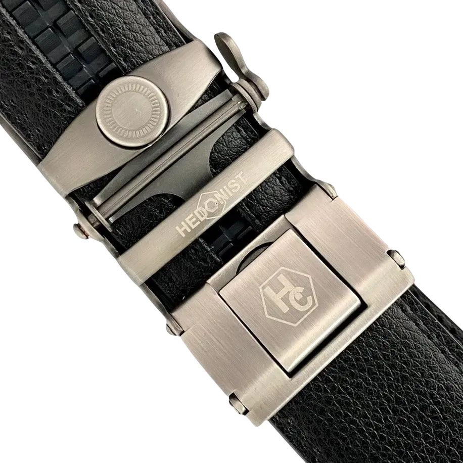 Black leather ratchet belt with silver buckle, hardware close-up