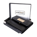 Small black leather snap wallet for women, presented as a gift