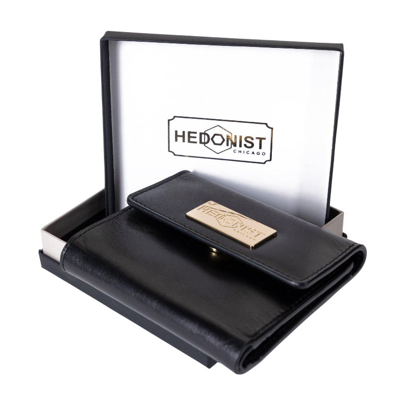 Small black leather snap wallet for women, presented as a gift