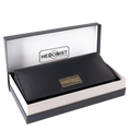 Black leather trifold wallet presented in Hedonist Chicago branded gift box
