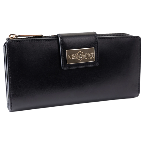 Black leather travel wallet closed, front flap with gold-tone Hedonist Chicago plaque