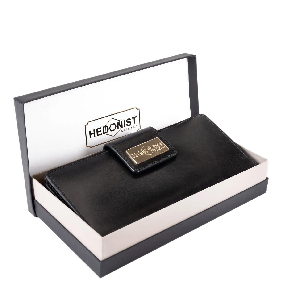 Black leather travel wallet presented in Hedonist Chicago branded gift box