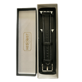 Black padded leather Apple Watch band, packaging close-up