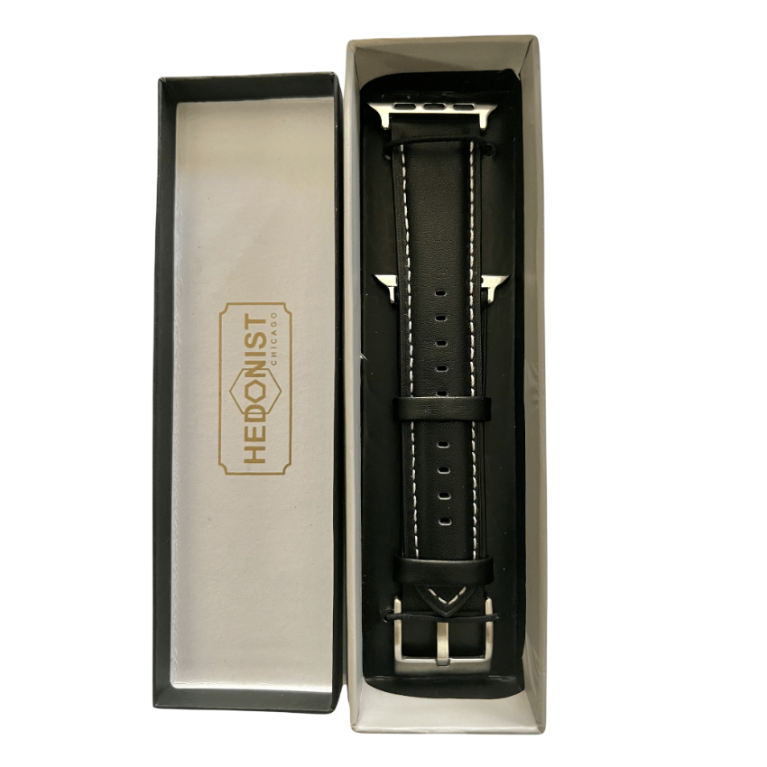 Black padded leather Apple Watch band, packaging close-up