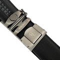Black stitched-edge leather ratchet belt, close-up of edge stitching