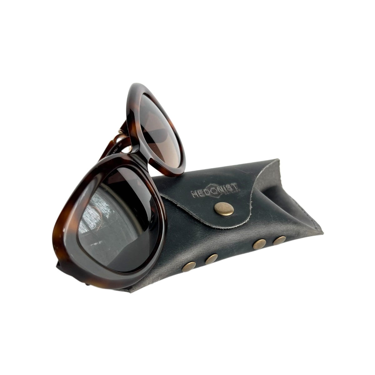 Soft Leather Eye Glasses Case in Black Washed with tortoiseshell sunglasses leaning against it
