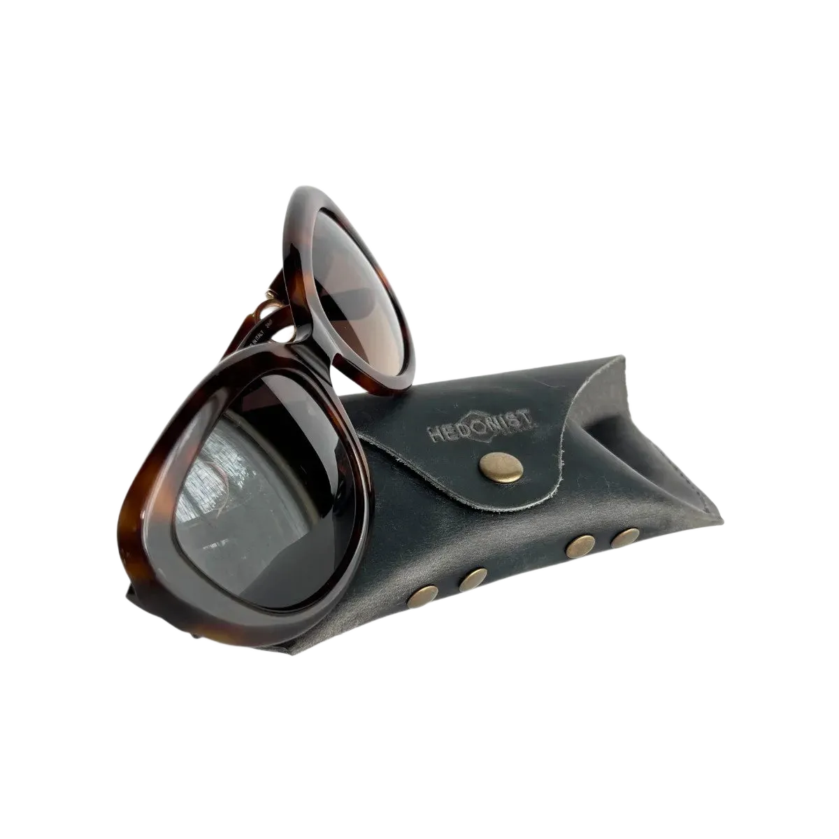 Soft Leather Eye Glasses Case in Black Washed with tortoiseshell sunglasses leaning against it