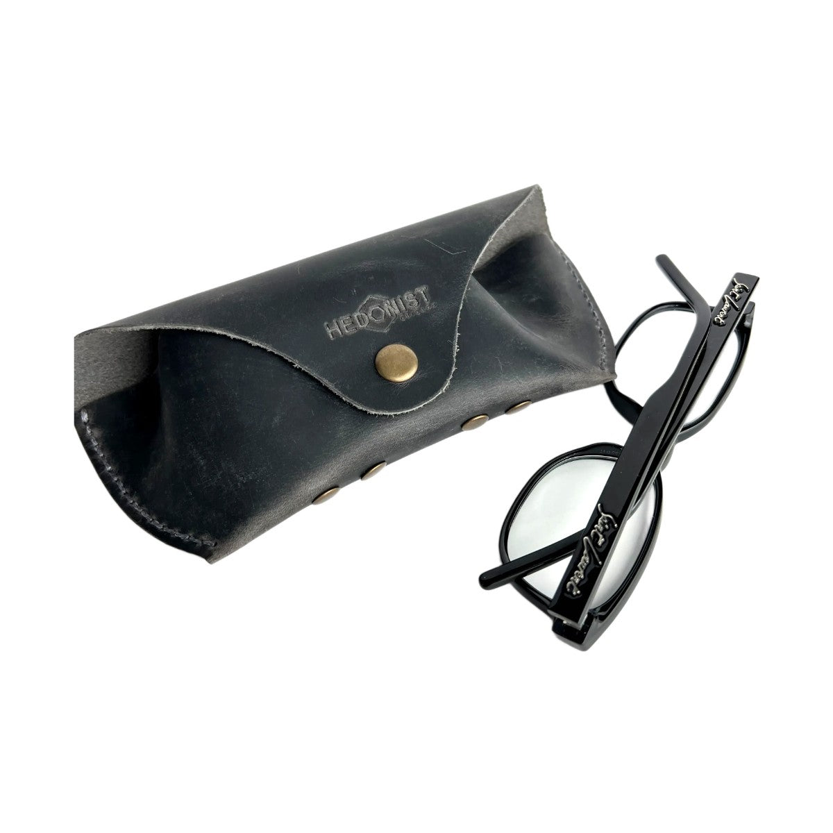 Soft Leather Eye Glasses Case in Black Washed with black cat-eye glasses leaning beside it