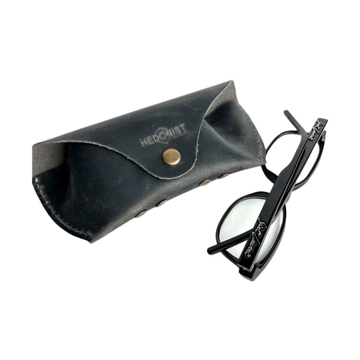Soft Leather Eye Glasses Case in Black Washed with black cat-eye glasses leaning beside it