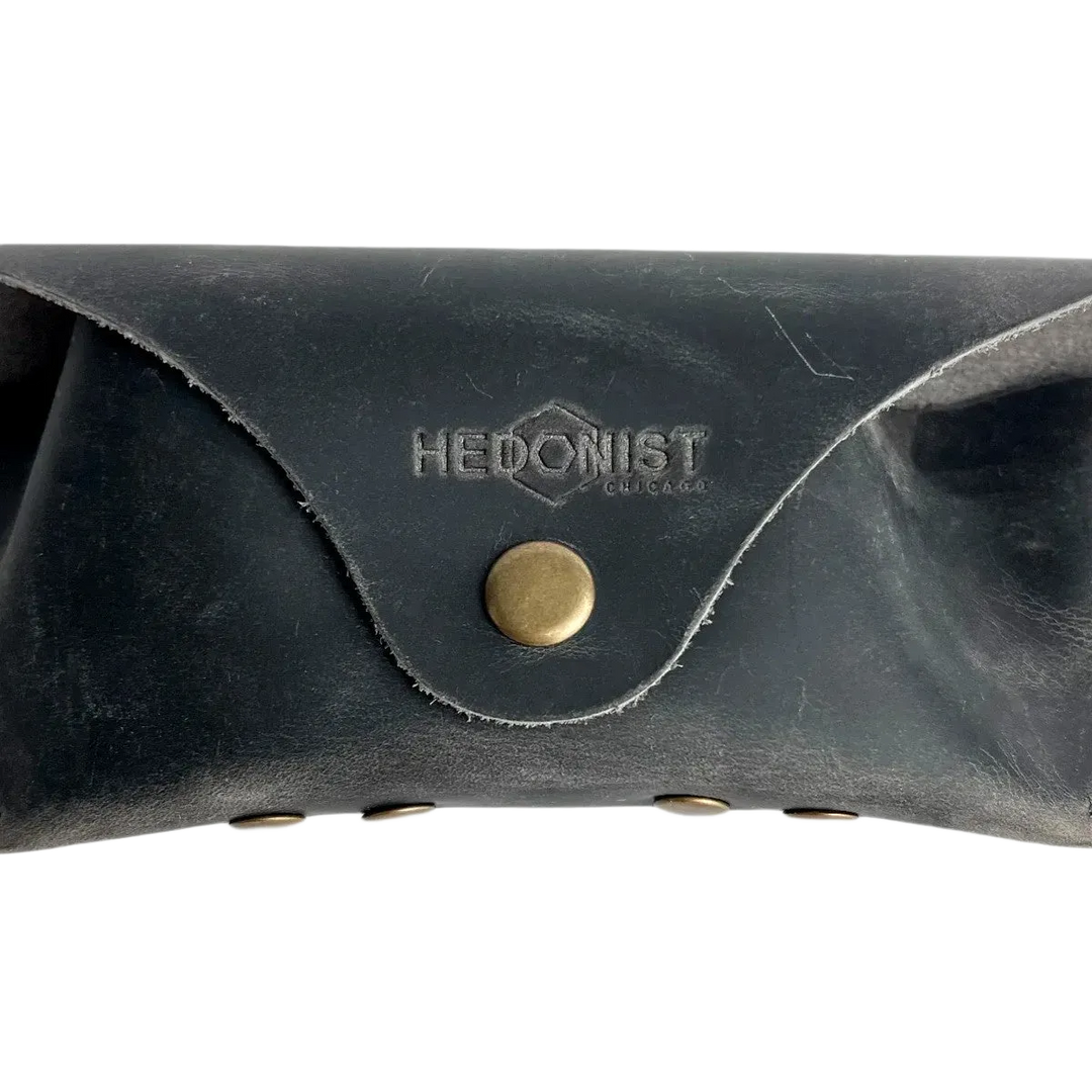 Soft Leather Eye Glasses Case in Black Washed, closed, front view showing weathered grain and embossed Hedonist logo