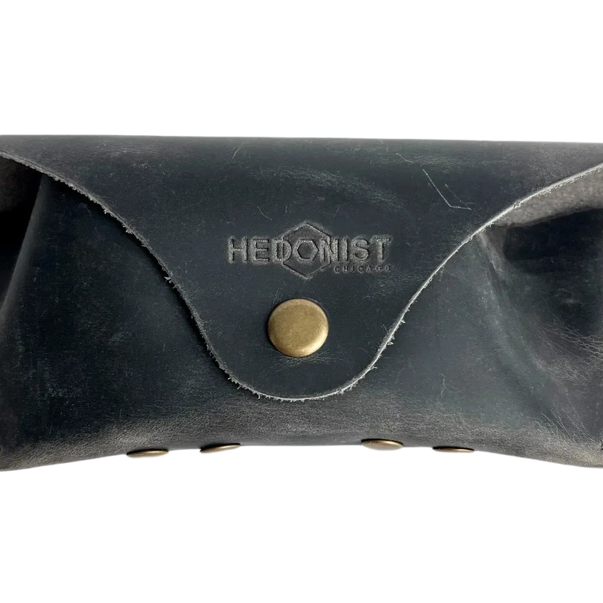 Soft Leather Eye Glasses Case in Black Washed, closed, front view showing weathered grain and embossed Hedonist logo