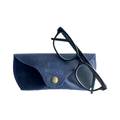 Soft Leather Eye Glasses Case in Navy Blue with black-framed eyeglasses resting on top